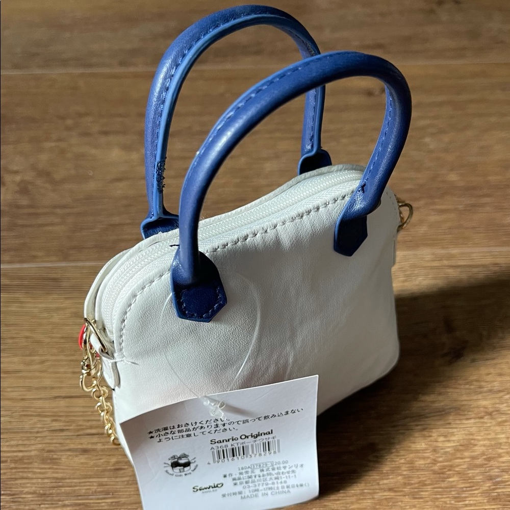 HELLO KITTY-NWT Mini Faux Leather Handbag - Picture 2 of 12